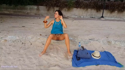 Naughty girl without panties on the beach in Miami